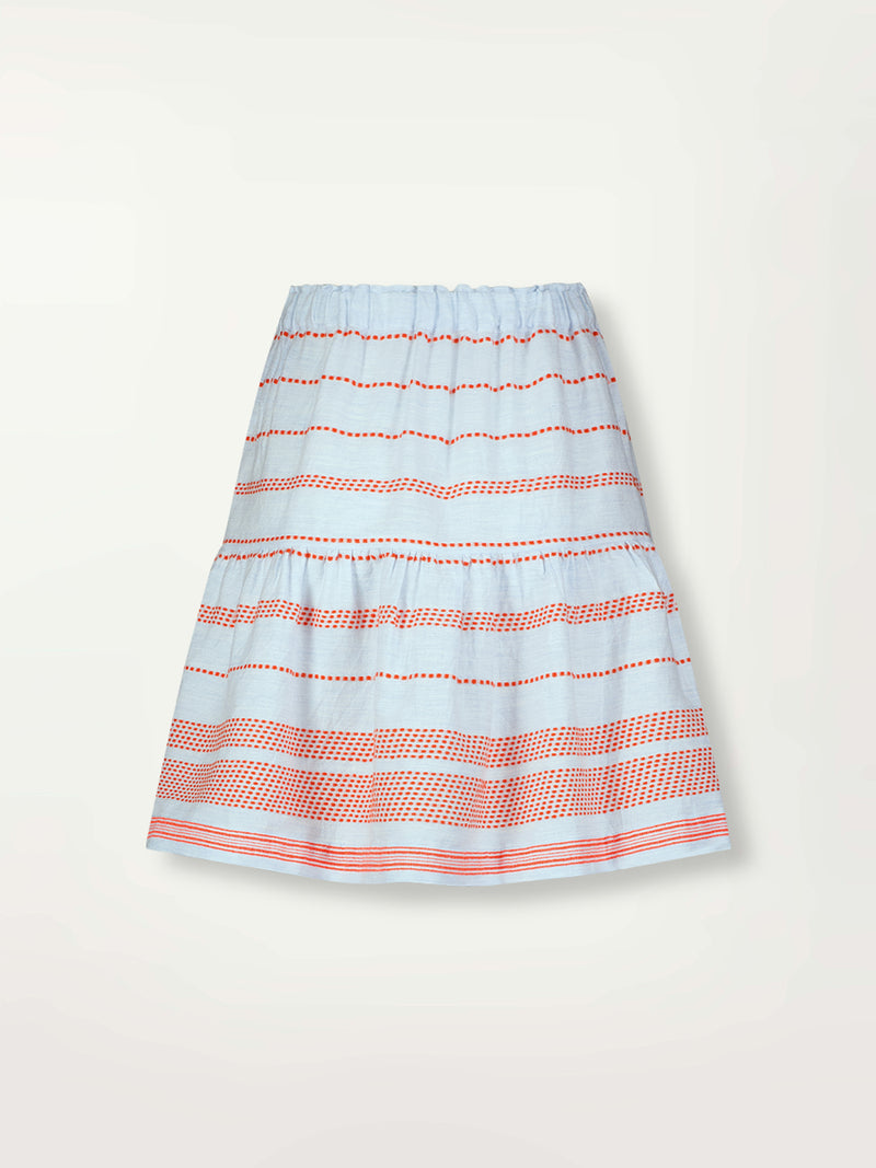 Product Back Shot of lemlem Cheri Skirt featuring playful pattern of red dots becoming stripes on a pale blue background