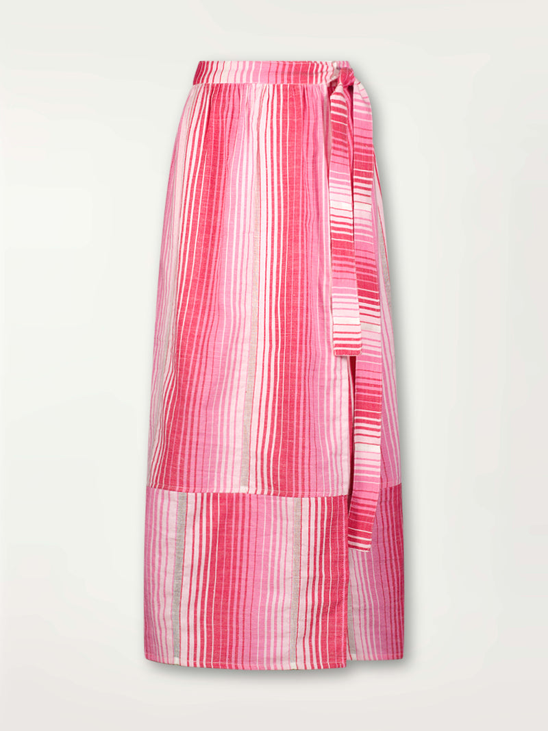 Product Front Shot of lemlem Salana Wrap Skirt featuring white, soft pink, and raspberry stripes that effortlessly blend into a stunning ombre effect