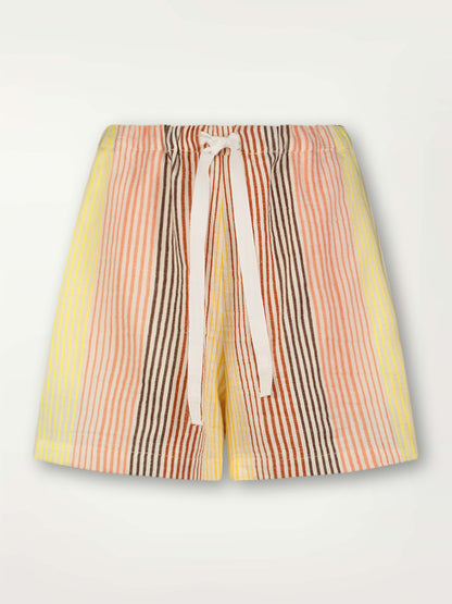 Product Front Shot of lemlem Safia Shorts  featuring continuous stripe pattern in warm yellow, orange and peach tones.