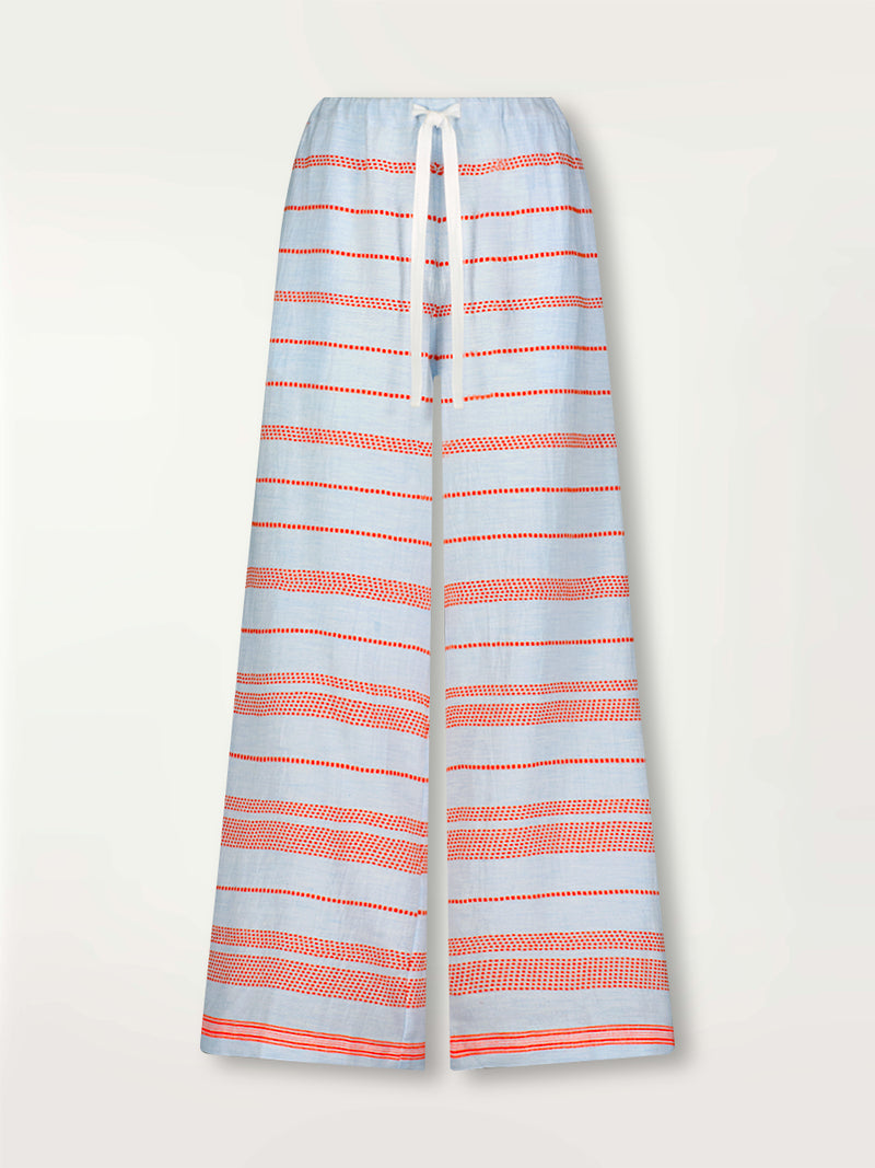 Product Front Shot of lemlem Desta Pants featuring playful pattern of red dots becoming stripes on a pale blue background