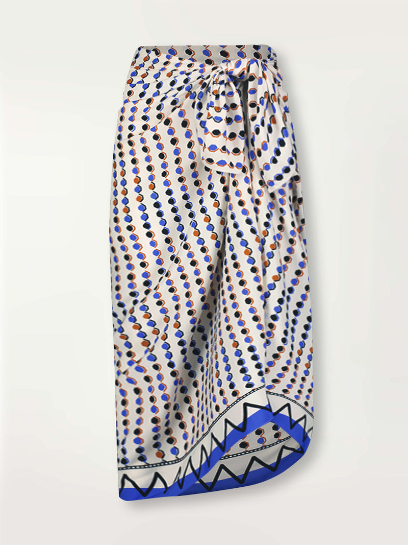 Product Front Shot of lemlem Adia Sarong featuring diamond pattern in natural terracotta and rich blue hues against a cream background