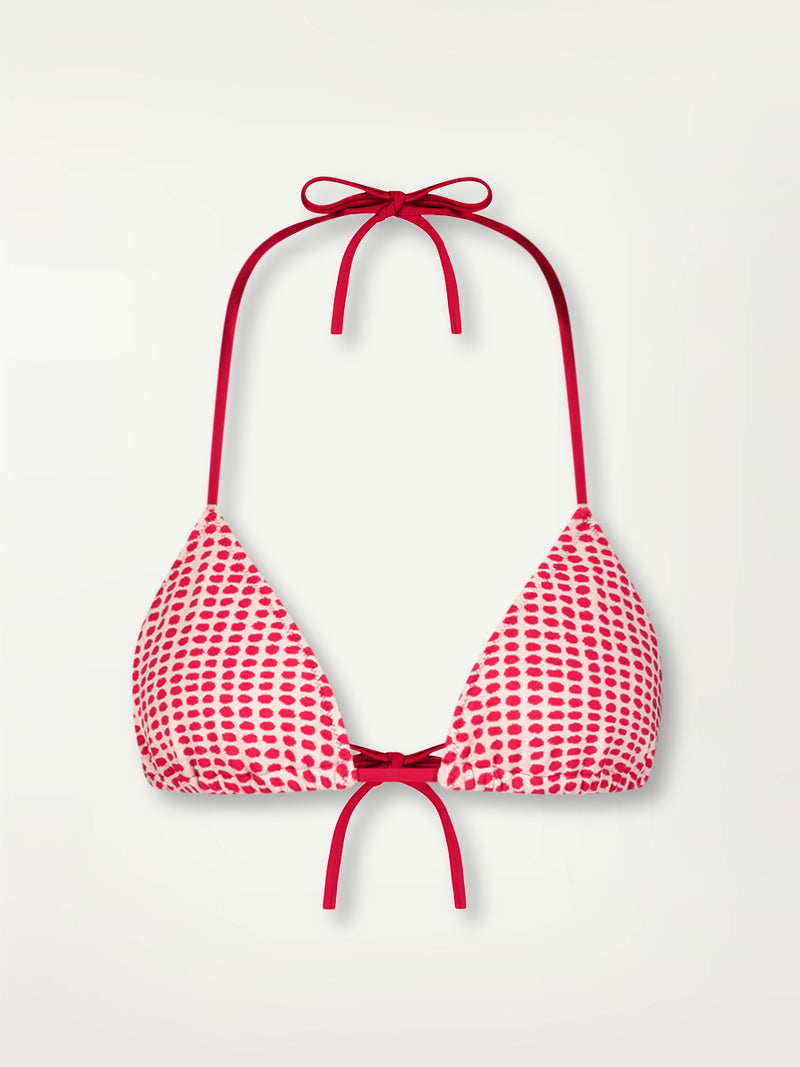 Product Front Shot of lemlem Malia Triangle Top featuring vibrant raspberry dots on an ivory background