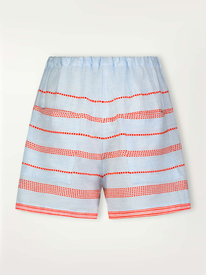 Product Back Shot of lemlem Safia Shorts featuring playful pattern of red dots becoming stripes on a pale blue background