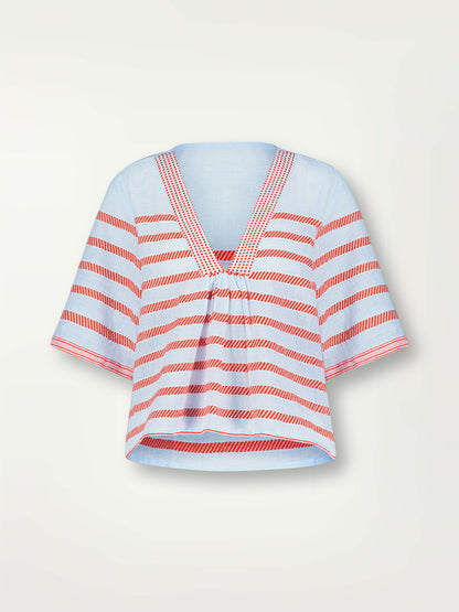 Product Front Shot of lemlem Rita V Neck Top featuring playful pattern of red dots becoming stripes on a pale blue background