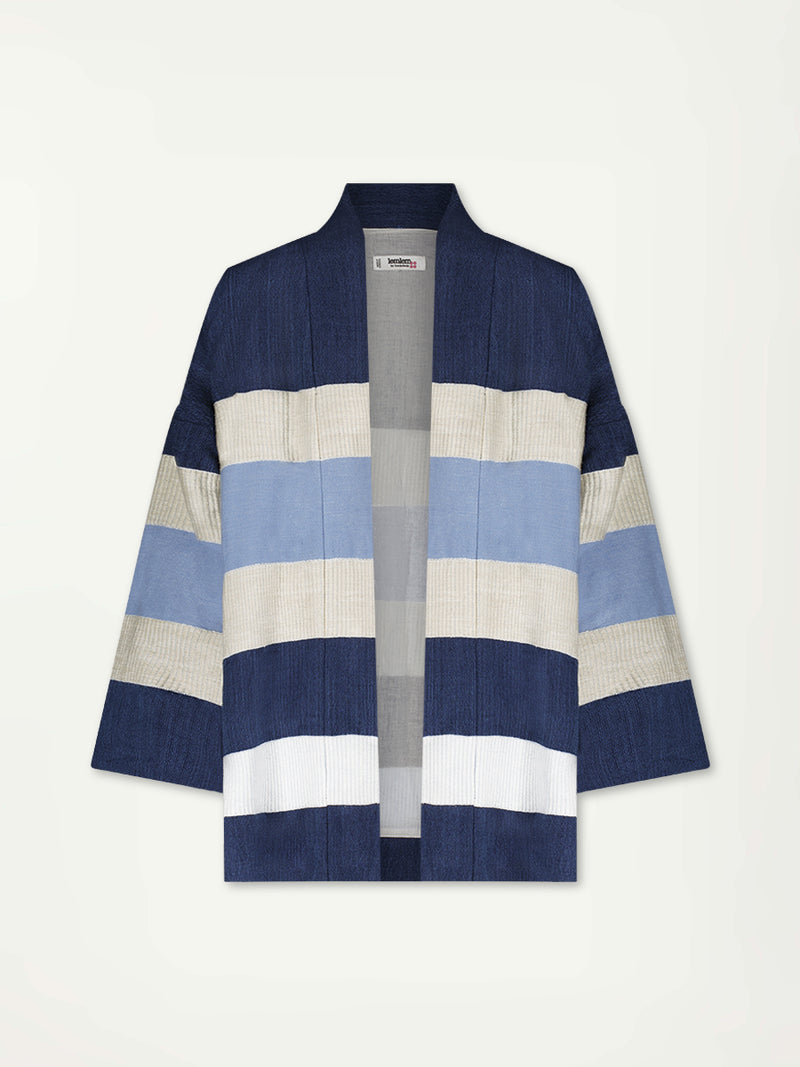 Product Front Shot of lemlem Terrara Jacket featuring a striking color-block combination of three shades of blue, paired with bands of neutral cream and white, inspired by handmade indigo quilting and African textil.