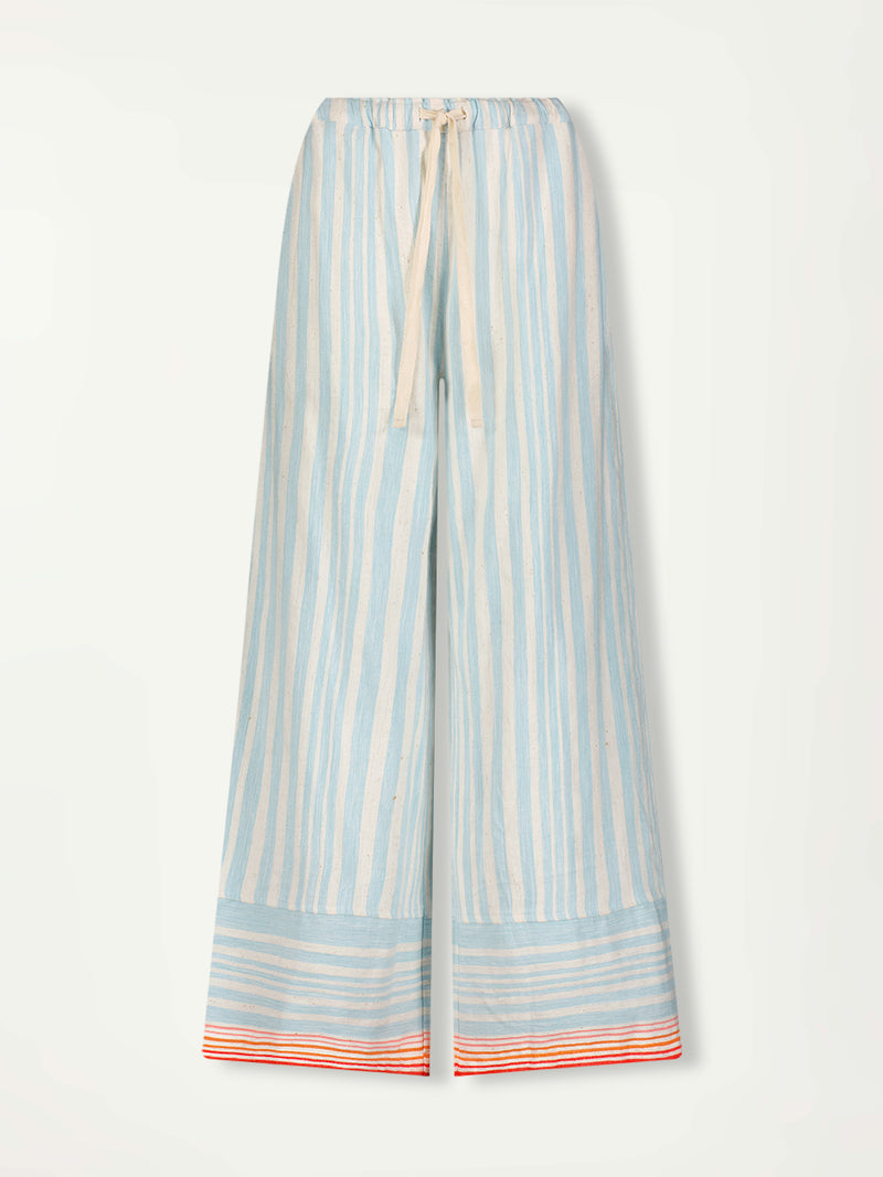 Product Front Shot of lemlem Desta Pants featuring soft, variegated two-color stripe in sky blue and cream, complemented by placed bands of bright orange and tangerine