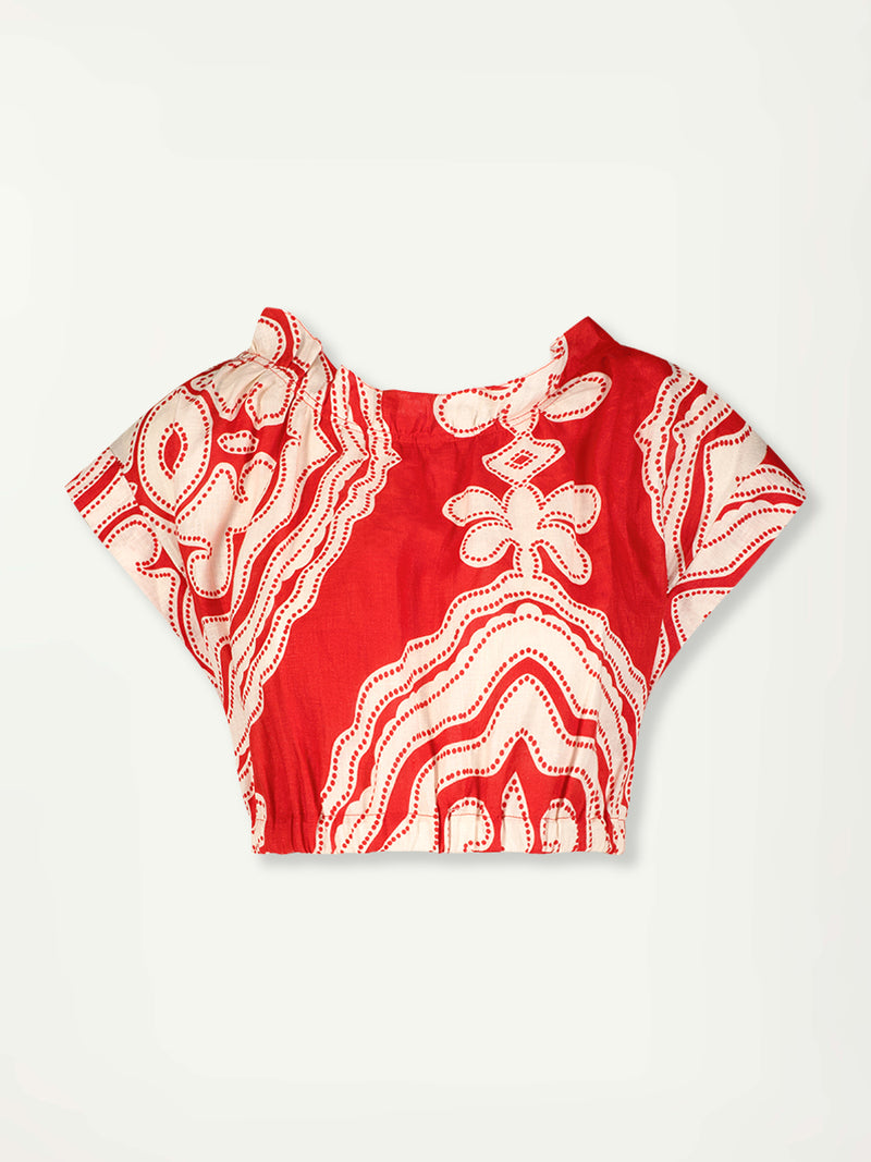 Product Front Shot of lemlem MUNA Crop Top featuring custom-designed print inspired by ancient architectural patterns in rich, vibrant red and creamy ivory colors.