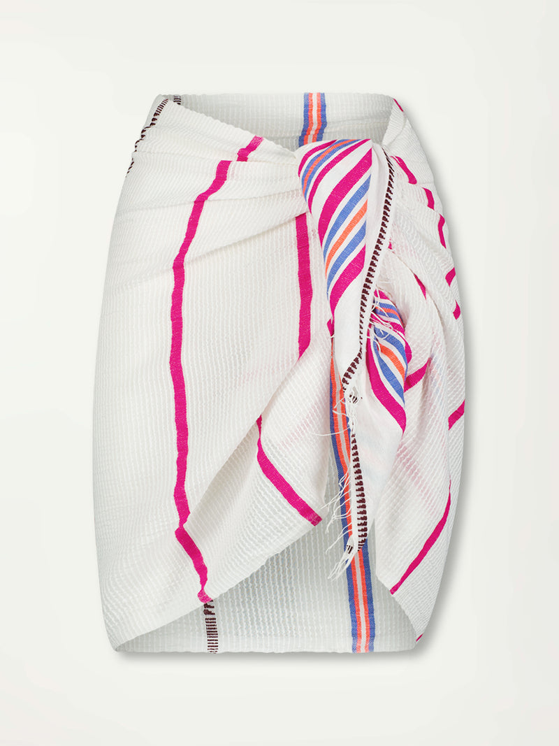 Product front shot of lemlem LEMA Sarong featuring stripe pattern of bright magenta, blue, and orange on s crispy white background