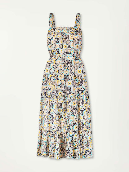 Product Front Shot of lemlem Sweepy Sundress featuring  prints inspired by the richly colored ceramic tiles of North Africa, in shades of honey, dark blue, pale blue, and navy blue