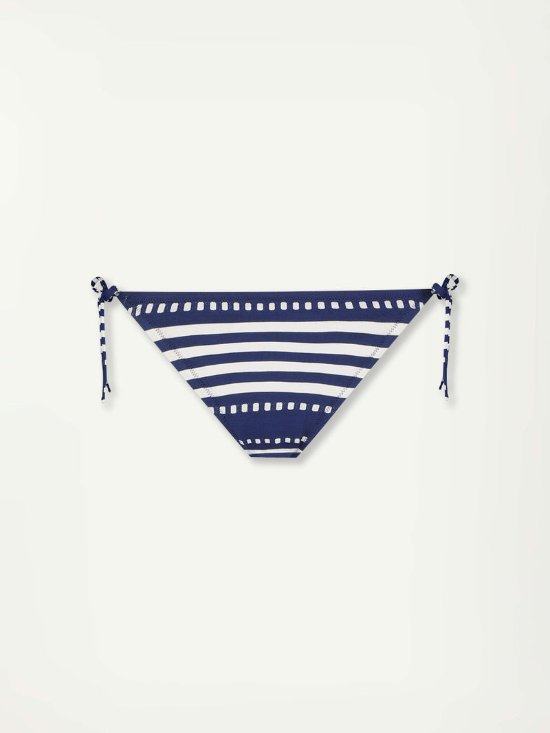 Product front shot of lemlem Rekka String Bottom featuring a classic navy background with ivory stripes and dots