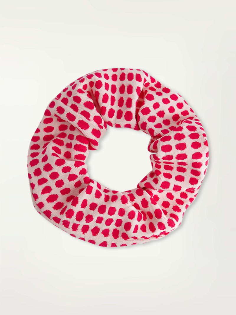 Product Front Shot of lemlem Lishan Scrunchie featuring vibrant raspberry dots on an ivory background