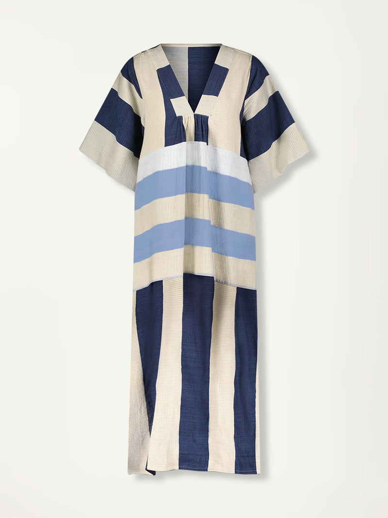 Product Front Shot of lemlem EDNA Dress featuring a striking color-block combination of three shades of blue, paired with bands of neutral cream and white background