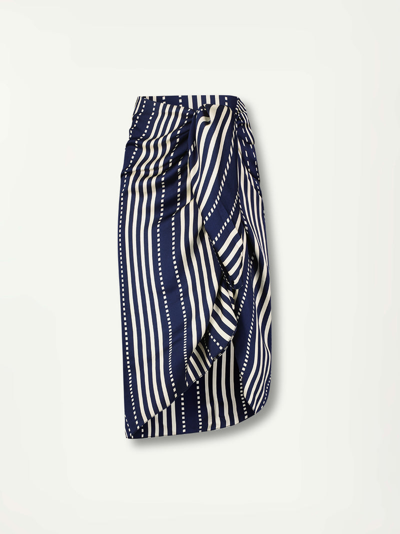 Product Front Shot of lemlem ADIA Sarong featuring a classic navy background with ivory stripes and dots on a silky fabric and a matching blouse