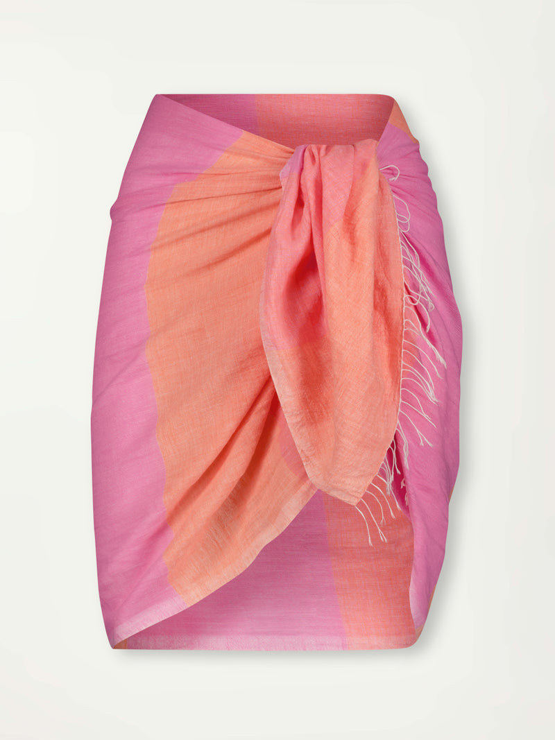 Product Front Shot of lemlem LEMA Sarong featuring gauzy fabric with a beautiful ombre color block of pink, blush, and peach colors and Triangle Bikini Top with String Bikini Bottom