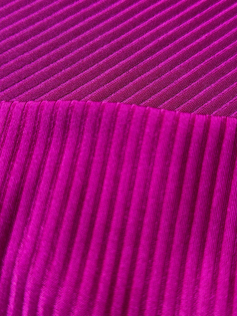 Close up on lemlem Beri Magenta Swim Fabric Featuring rich, opulent berry color and ribbed texture