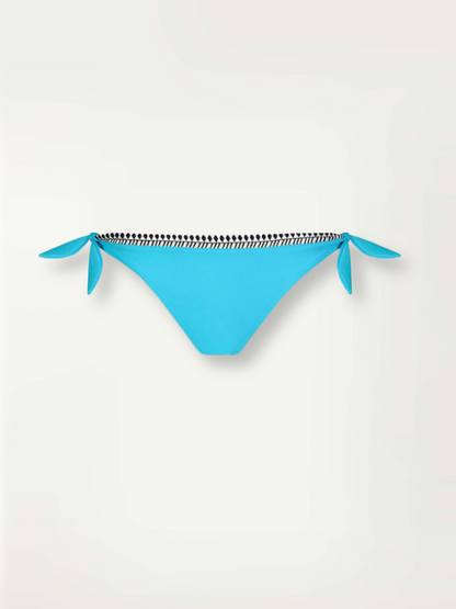 Product-shot turquoise Lena side tie bikini bottom with tibeb trim