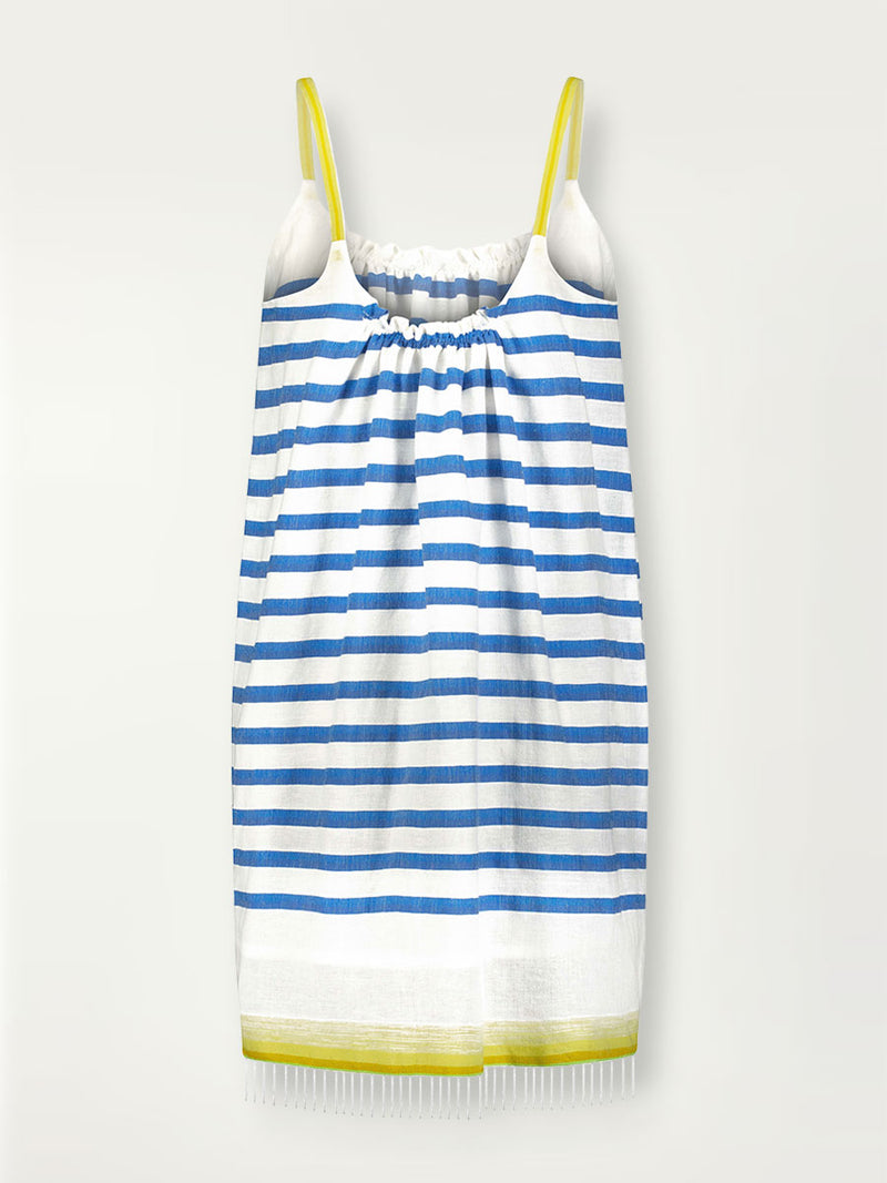 Product shot of the back of the Hirut Tunic Dress in Blue featuring blue stripes on white foreground and yellow degrade straps and stripes at the bottom hem.