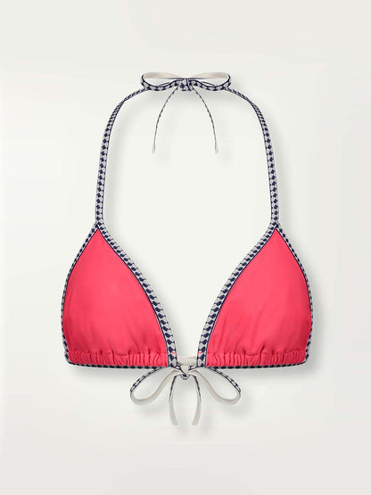 A product-shot of the front of the Lena Triangle Top in Hot Coral with white and navy diamond trim